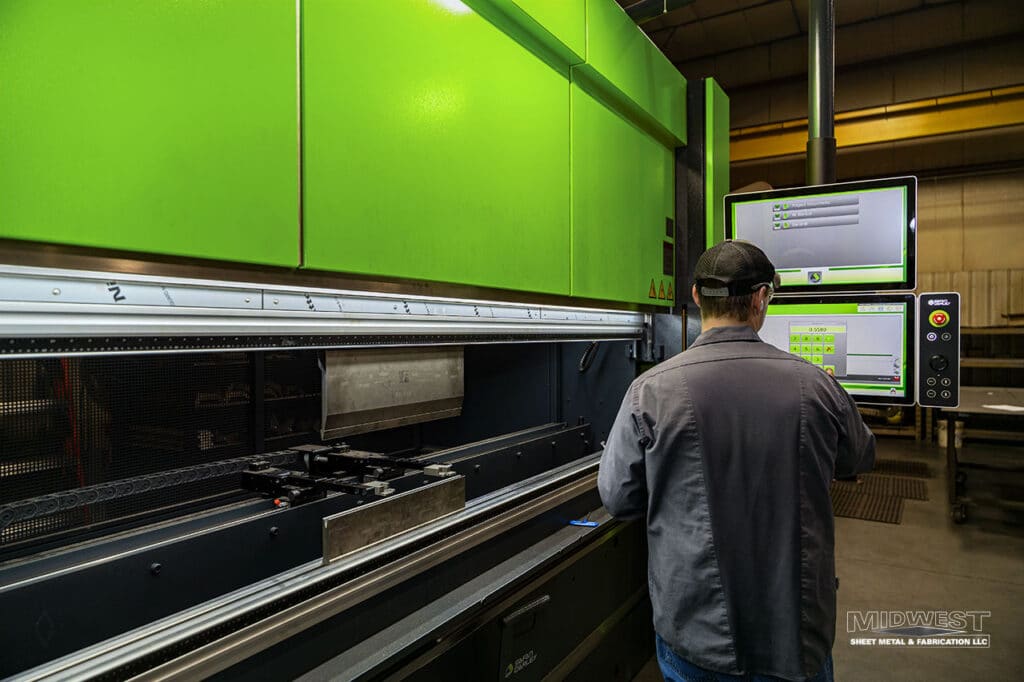 SafanDarley press brake operator performing sheet metal bending at Midwest Sheet Metal & Fabrication in Greenville, Wisconsin.